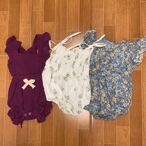 Assortment of baby rompers.